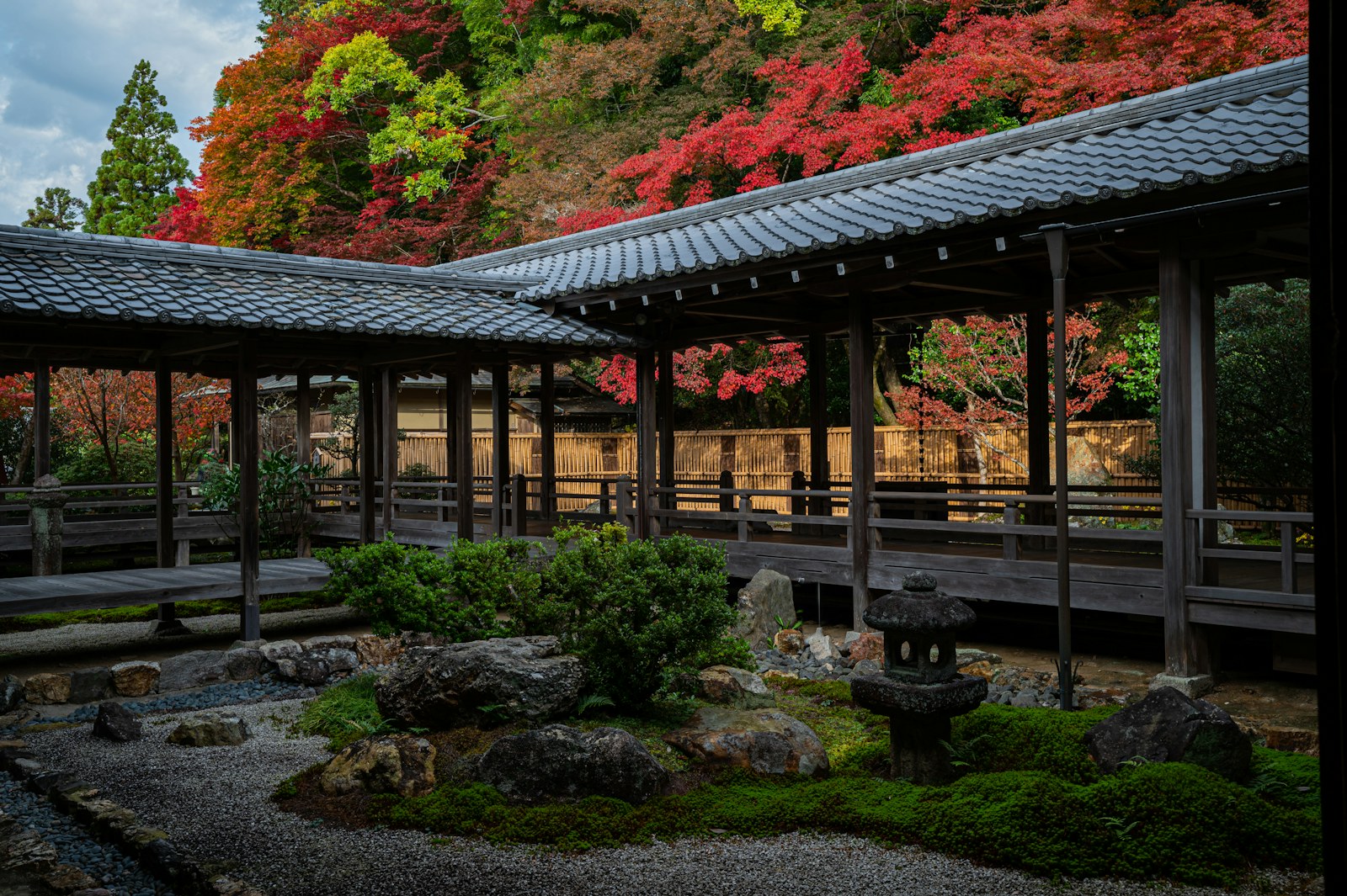 Japanese garden in Kyoto surrounded by autumn leaves