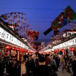 Shoppers walking along Nakamise shopping street in Asakusa, Tokyo