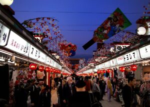 Shoppers walking along Nakamise shopping street in Asakusa, Tokyo