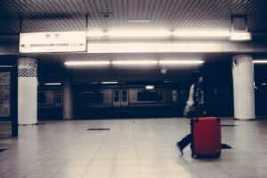 Traveler rolling a suitcase through Tokyo Station