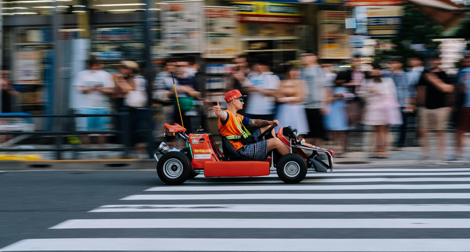 Street go-kart driving through a Tokyo crossing
