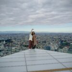 Visitors on the open-air SHIBUYA SKY rooftop overlooking Tokyo